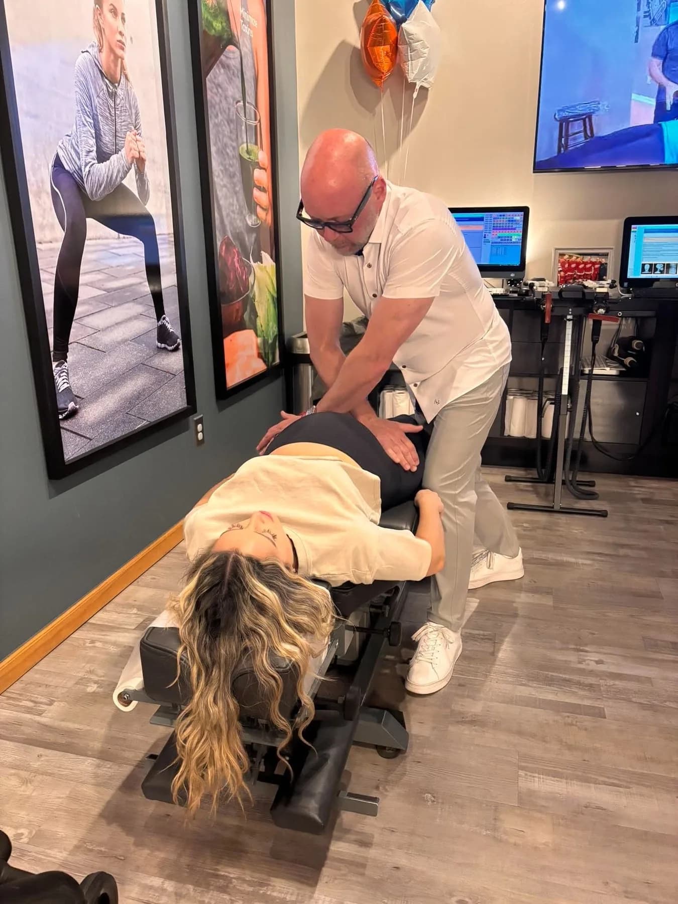 Dr. Ed McCuiston adjusting an adult patient in the clinic
