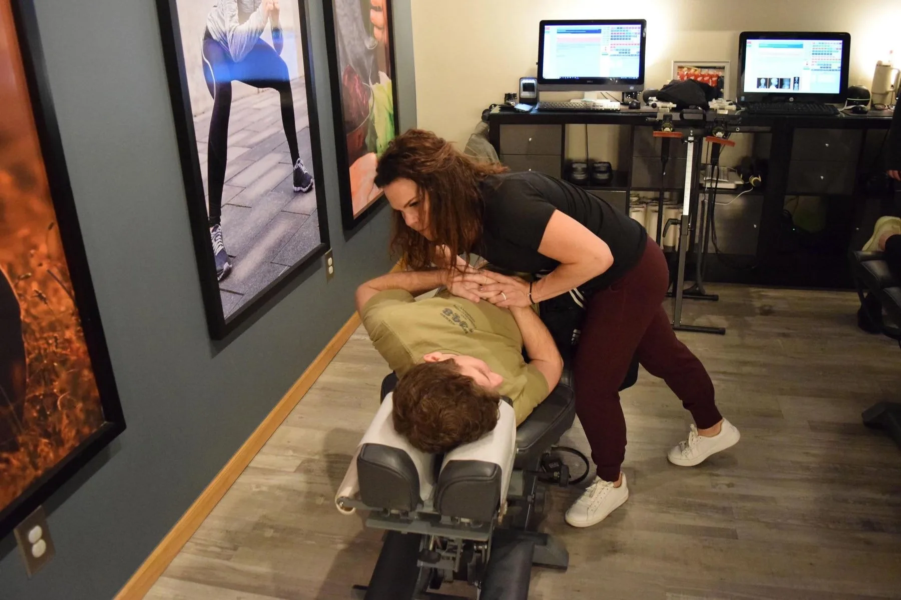 Dr. Sandie McCuiston adjusting a patient in a Touch of Life treatment room