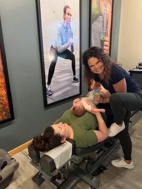 Dr. Sandie McCuiston adjusting a child at Touch of Life Chiropractic