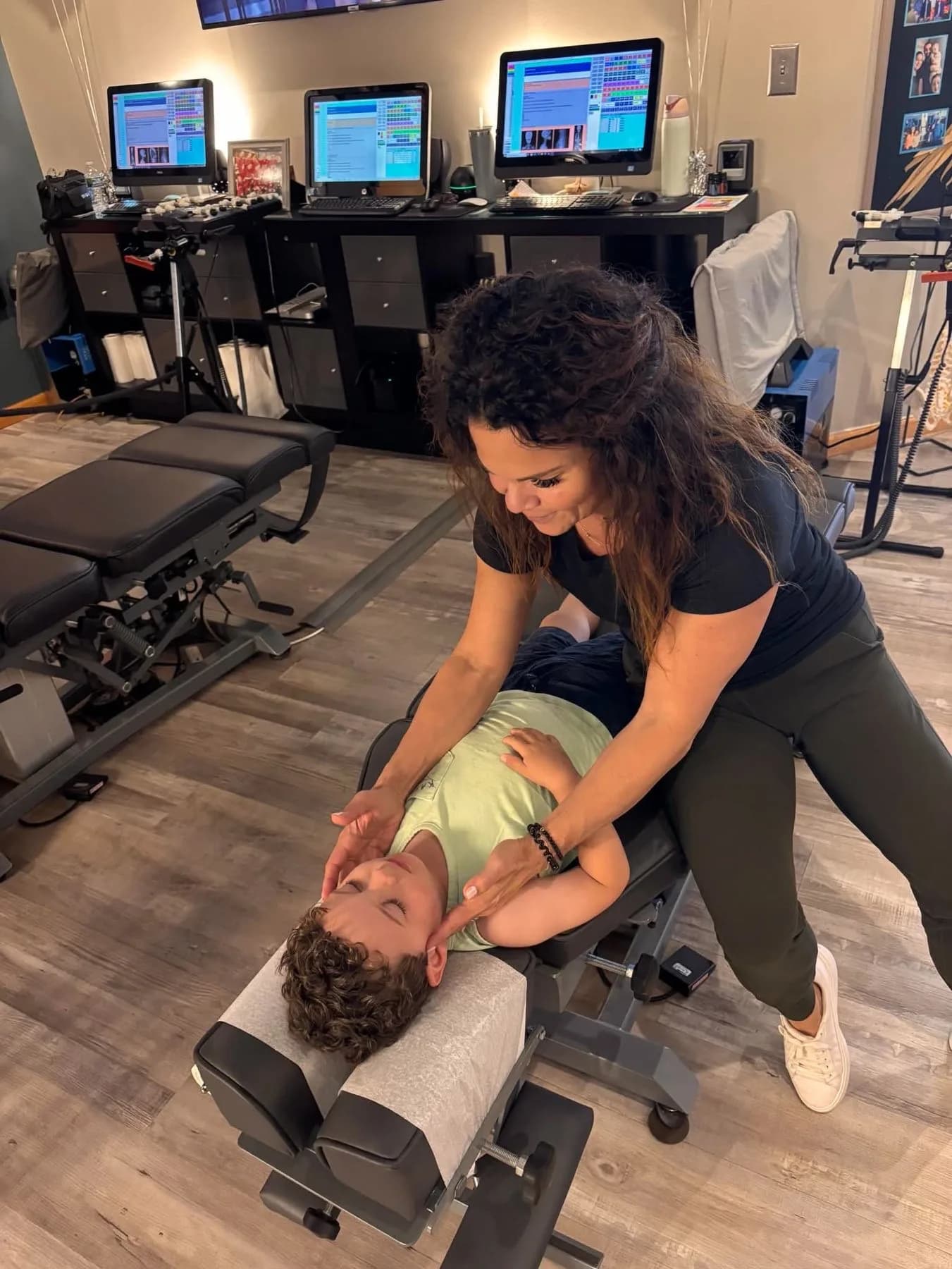 Dr. Sandie McCuiston providing gentle pediatric chiropractic care