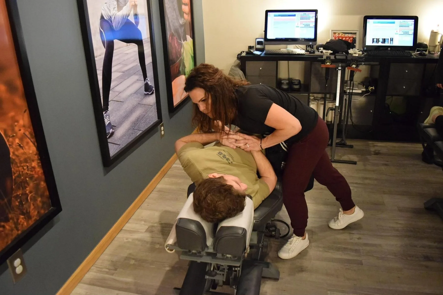 Dr. Sandie McCuiston providing chiropractic care inside Touch of Life Chiropractic